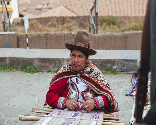 A relaxed person in Cusco wearing comfortable warm clothes
